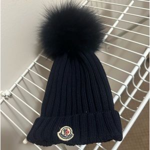 Moncler toddlers hate, navy blue, looks good and new.